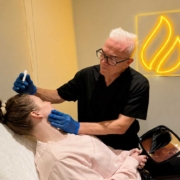 Corey Anderson RN consulting with a cosmetic patient at Core Aesthetics in Oakleigh, Melbourne before discussing non-surgical cosmetic treatment options.